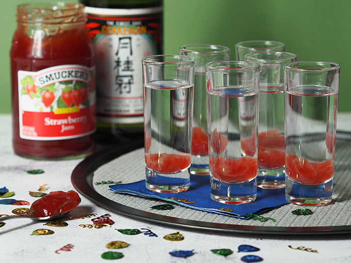 Two shot glasses sitting on a table