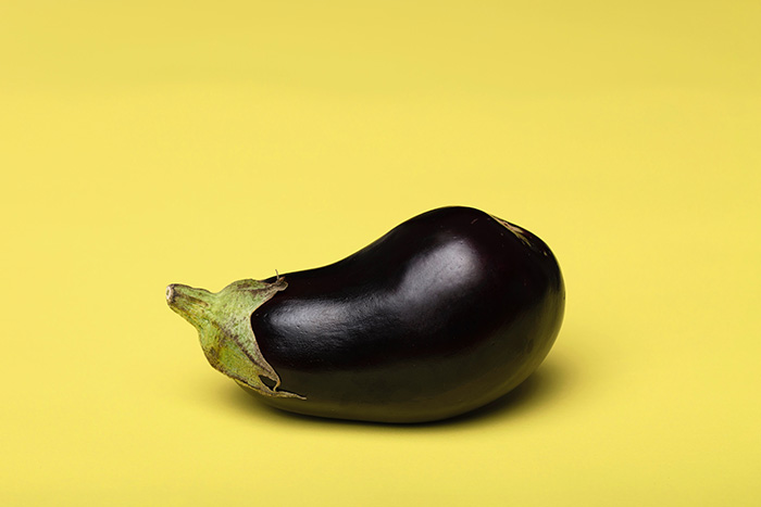 Eggplant on a yellow background