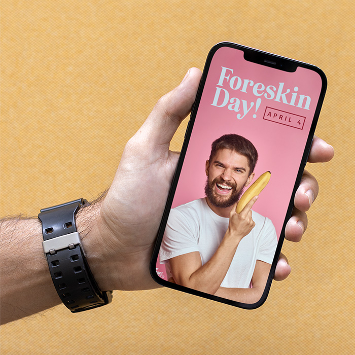 Image of a hand holding a phone with a pink graphic on it
