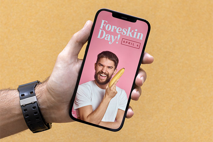 Image of a hand holding a phone with a pink graphic on it